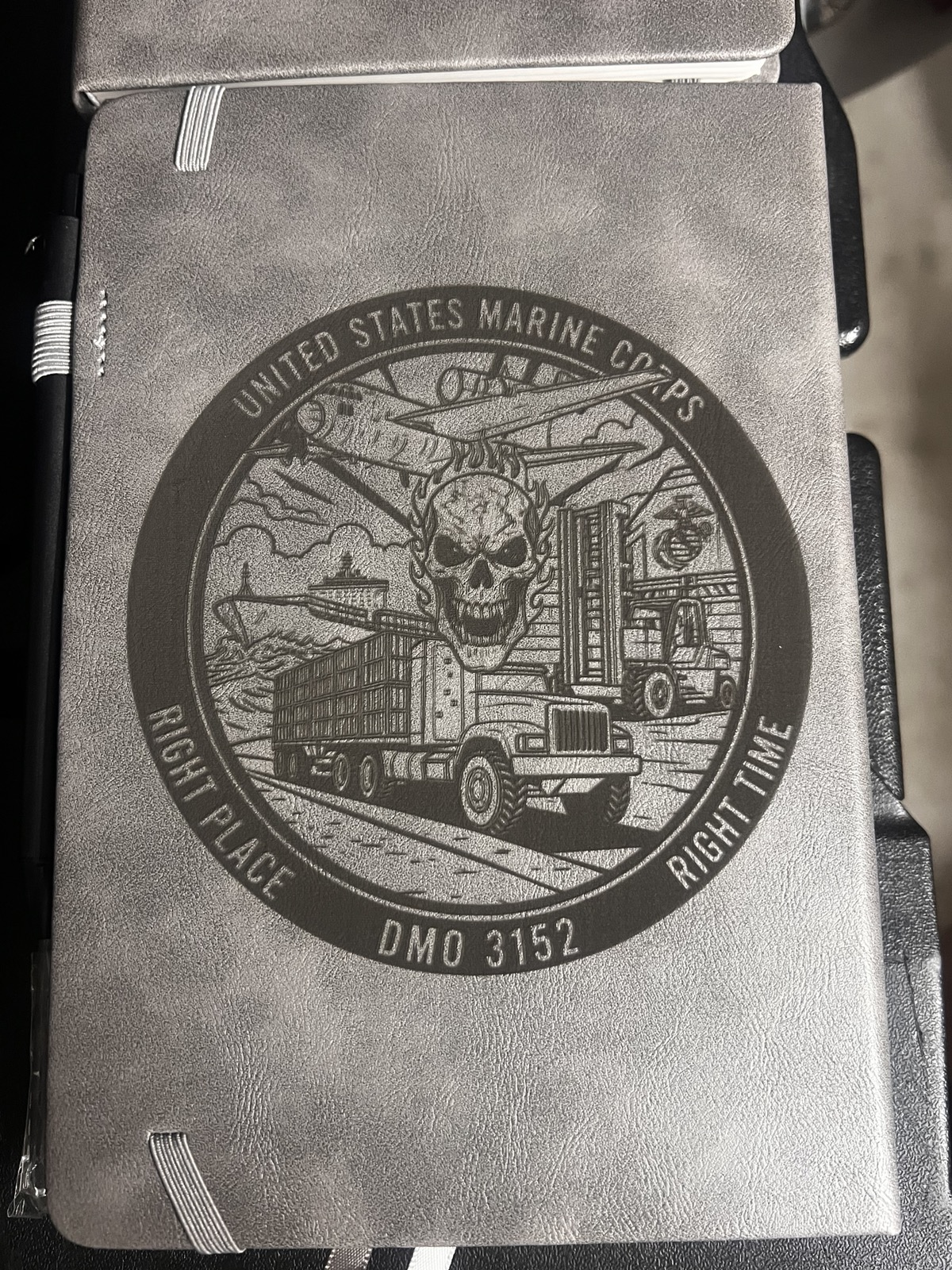 Detailed custom engraving on a gray book