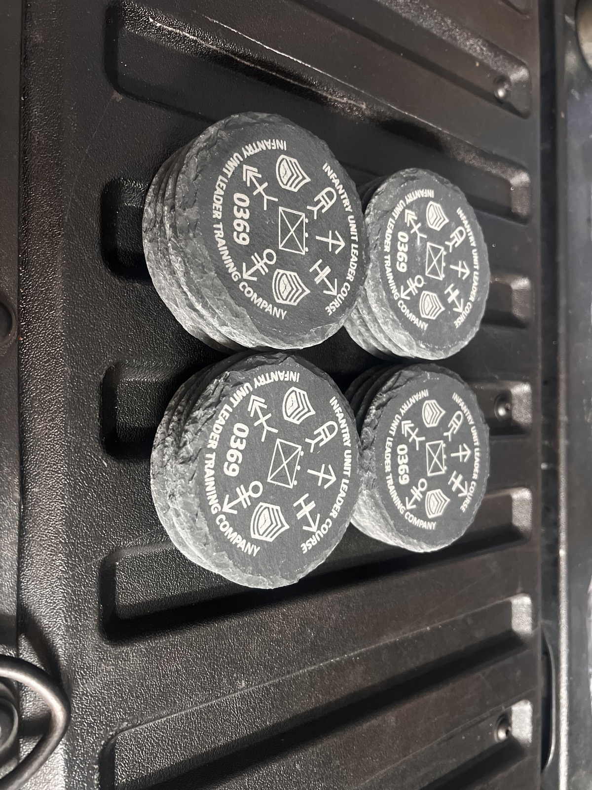 A set of custom engraved round coasters